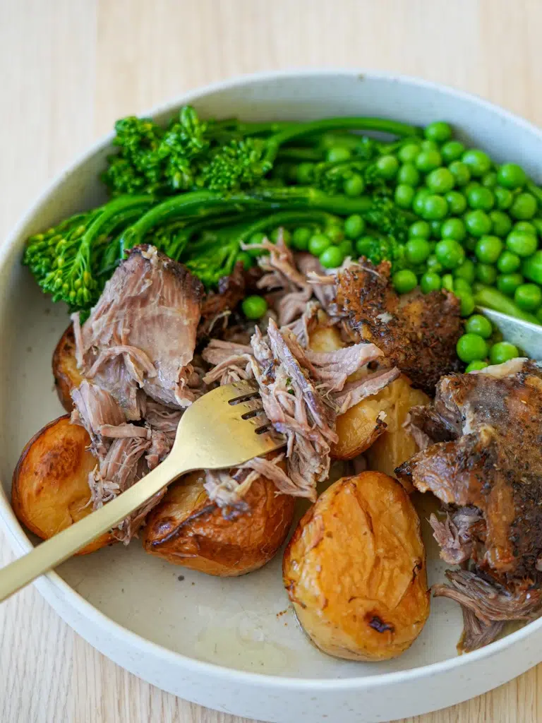 Close-up of tender Slow Cooker Lamb Shoulder with vegetables