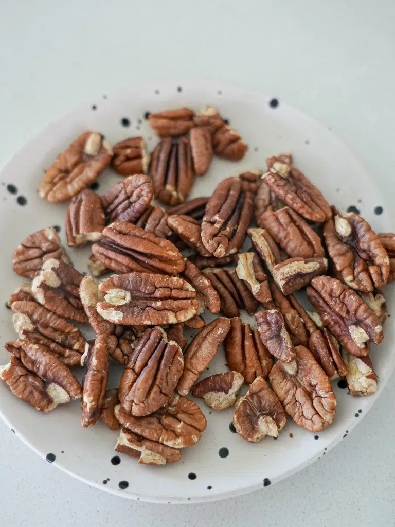 Pecans arranged on a plate