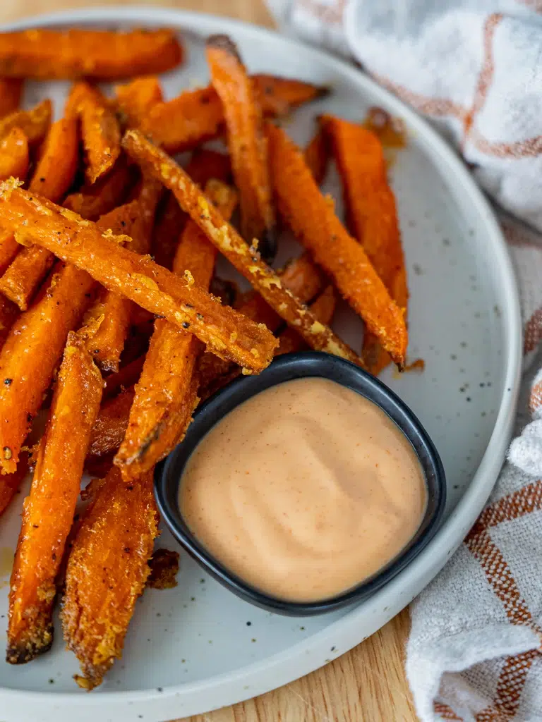 Sweet potato fries with a rich and tangy gochujang mayo on the side.