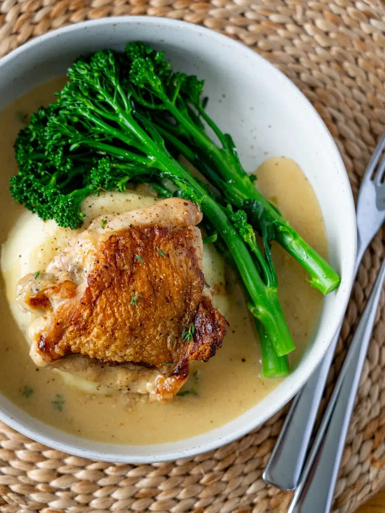 Top view of baked Dijon chicken plated and ready to serve.