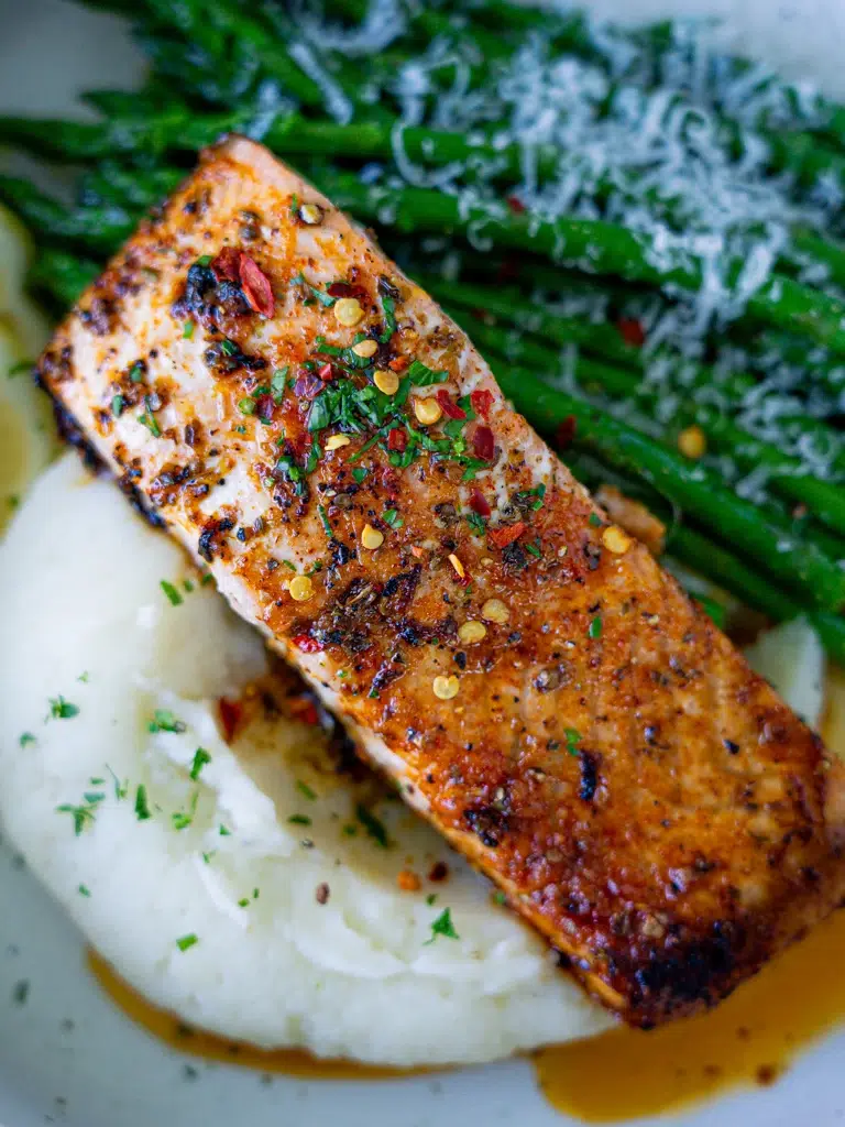 Close-up overhead view of a cooked salmon fillet.