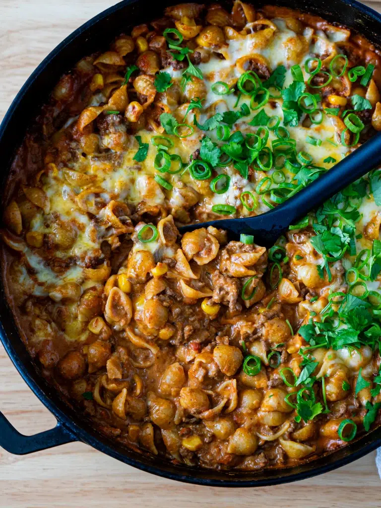 Close-up of cheesy one-pan taco mac and cheese in a skillet.