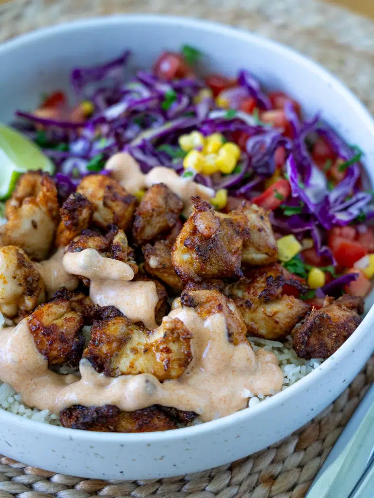 Close-up angled shot of Peri Peri chicken highlighting the texture and seasoning