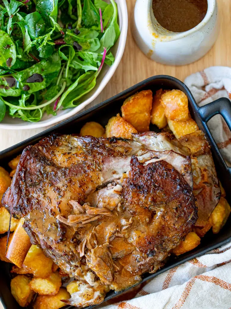 Shredded Rosemary Garlic Lamb with gravy served on a tray