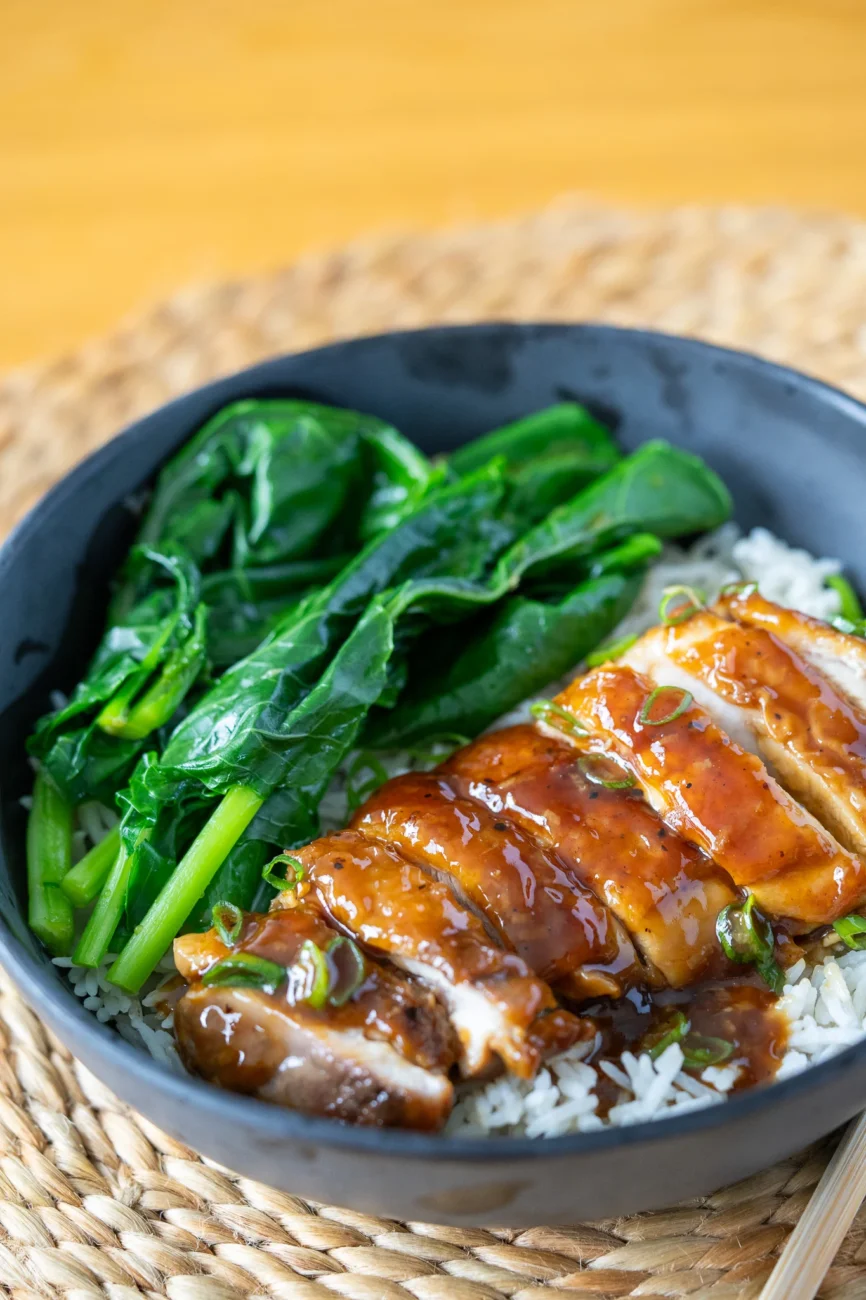 Honey Garlic Chicken Thigh recipe in bowl with rice and asian greens
