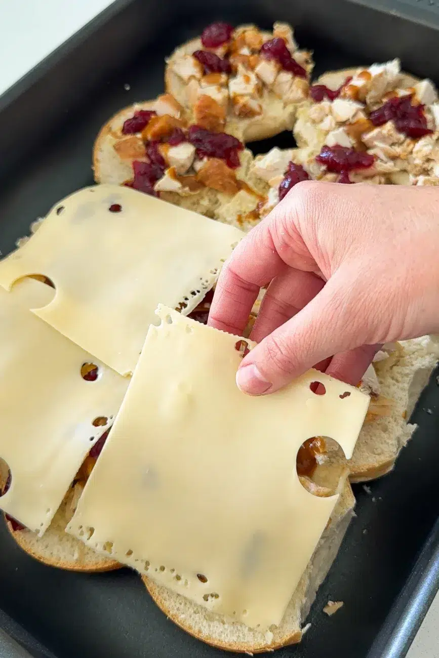 Cheese going onto Turkey Sliders