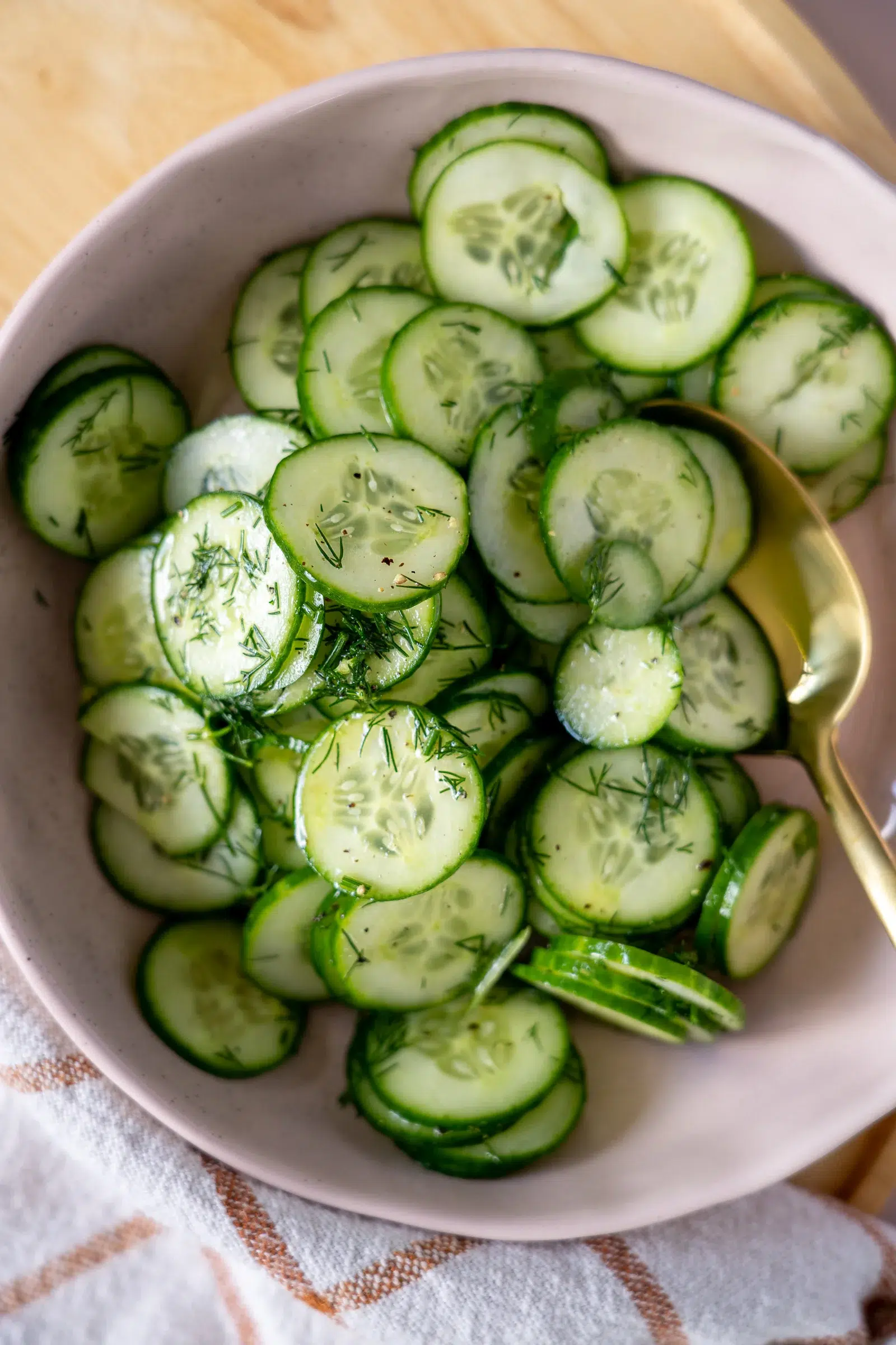 dill cucumber salad recipe in pink bowl